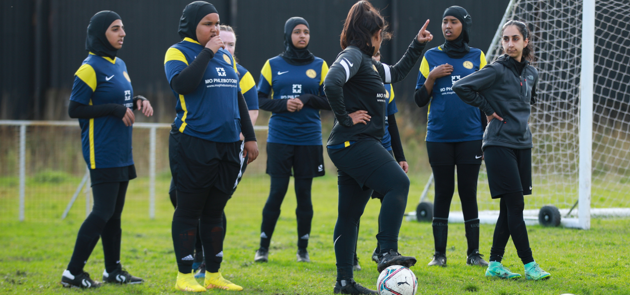 Group of girls playing football