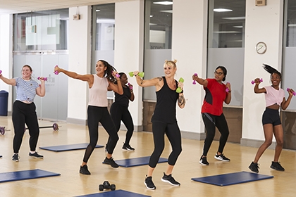 A group of women take part in an exercise class