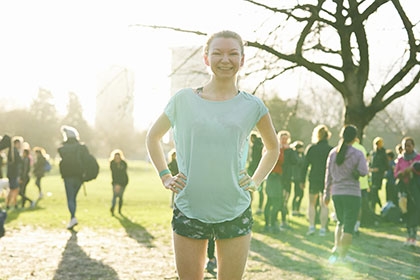 A woman gets ready for running outdoors