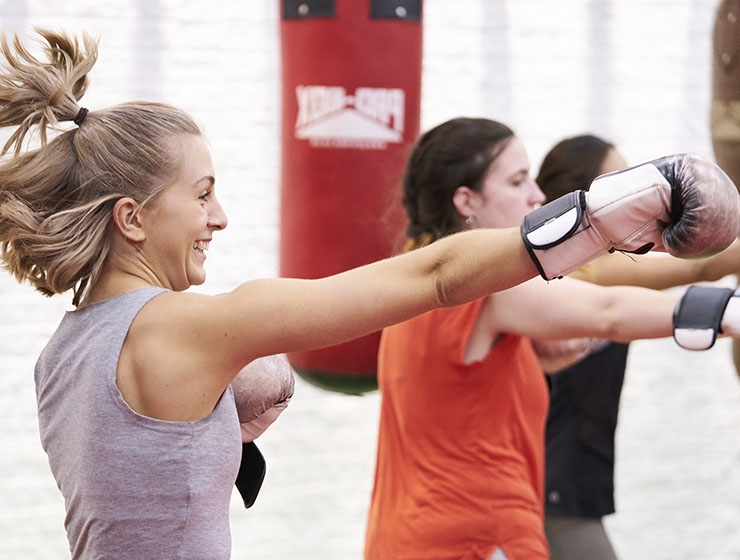 Women take part in a boxing exercise class
