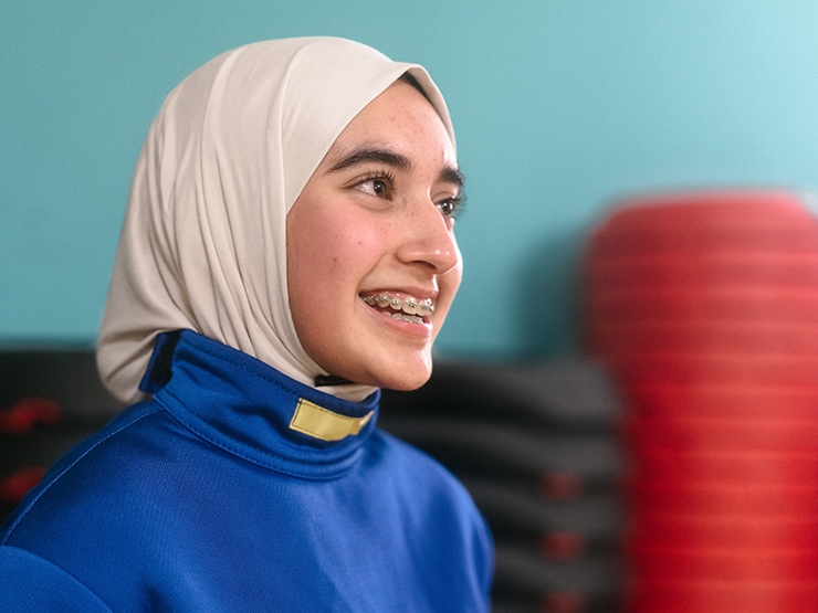A muslim woman at a fencing class