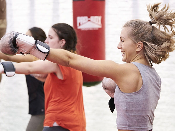 A woman takes part in a boxing class