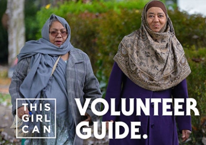 Two women walk in the street